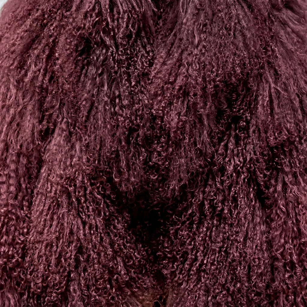 Close-up of Burgundy Mongolian fur coat showing dense curly shearling texture – UK women’s winter outerwear