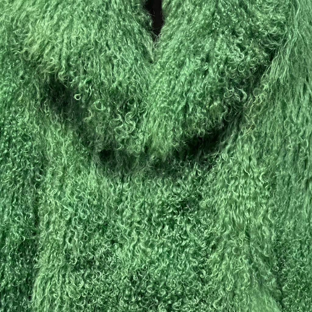 Close-up of Green Mongolian fur coat showing dense curly shearling texture – UK women’s winter outerwear
