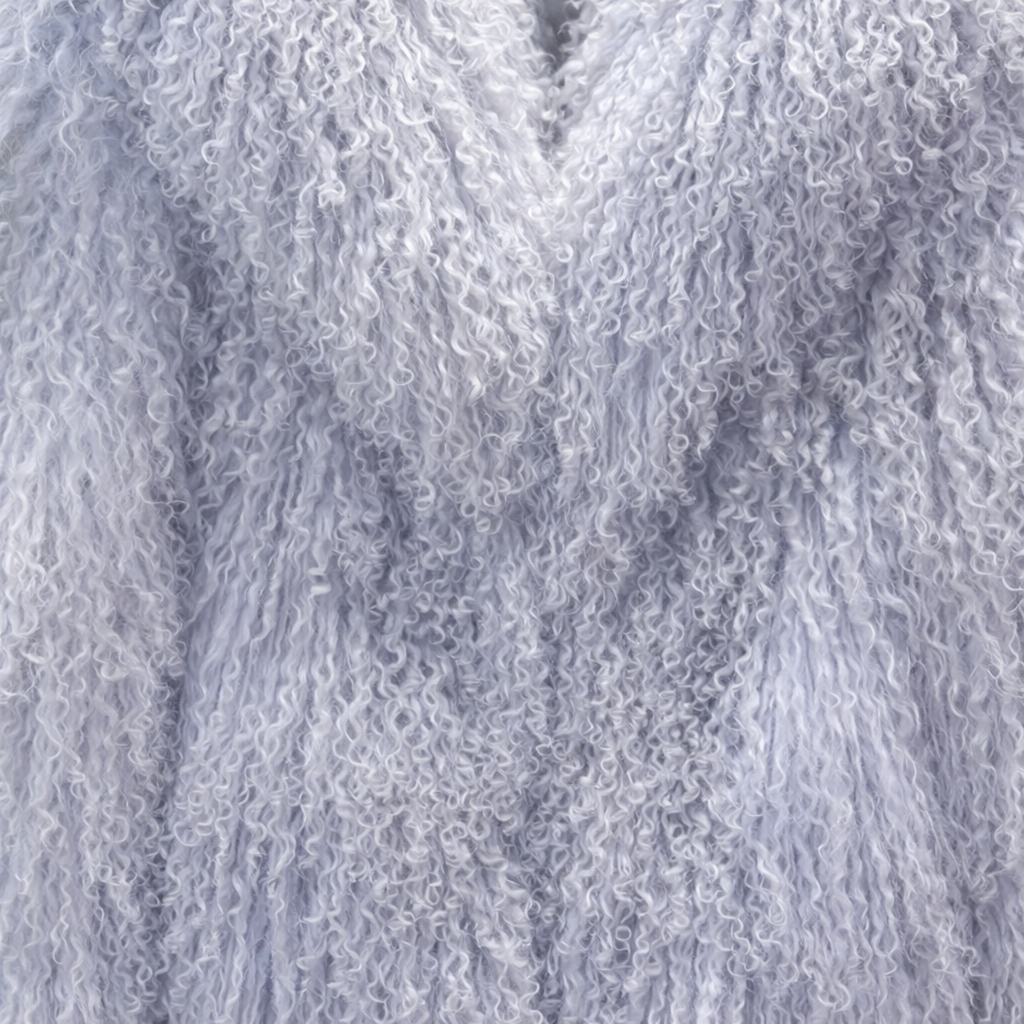 Close-up of lavender blue Mongolian fur coat showing dense curly shearling texture – UK women’s winter outerwear
