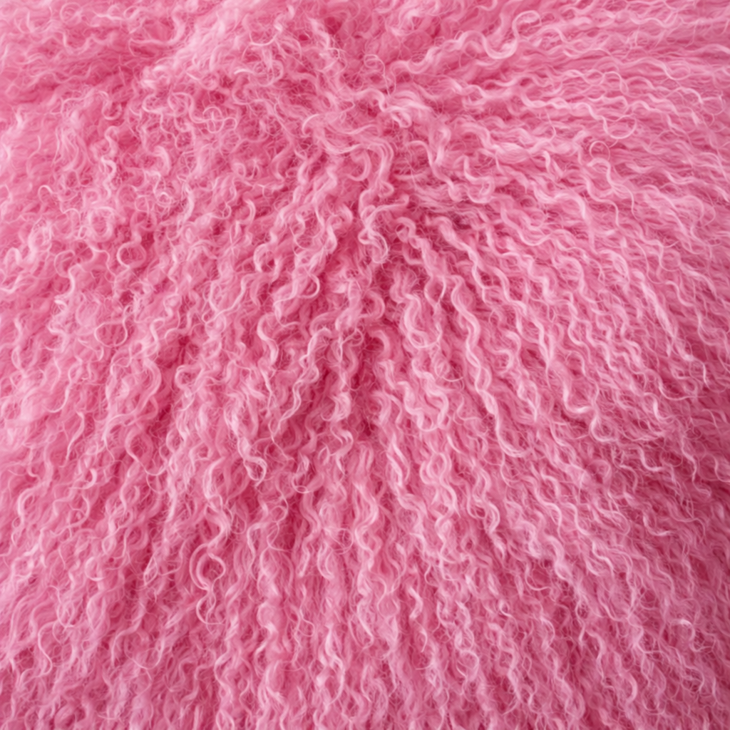 Close-up of pink Mongolian fur coat showing dense curly shearling texture – UK women’s winter outerwear