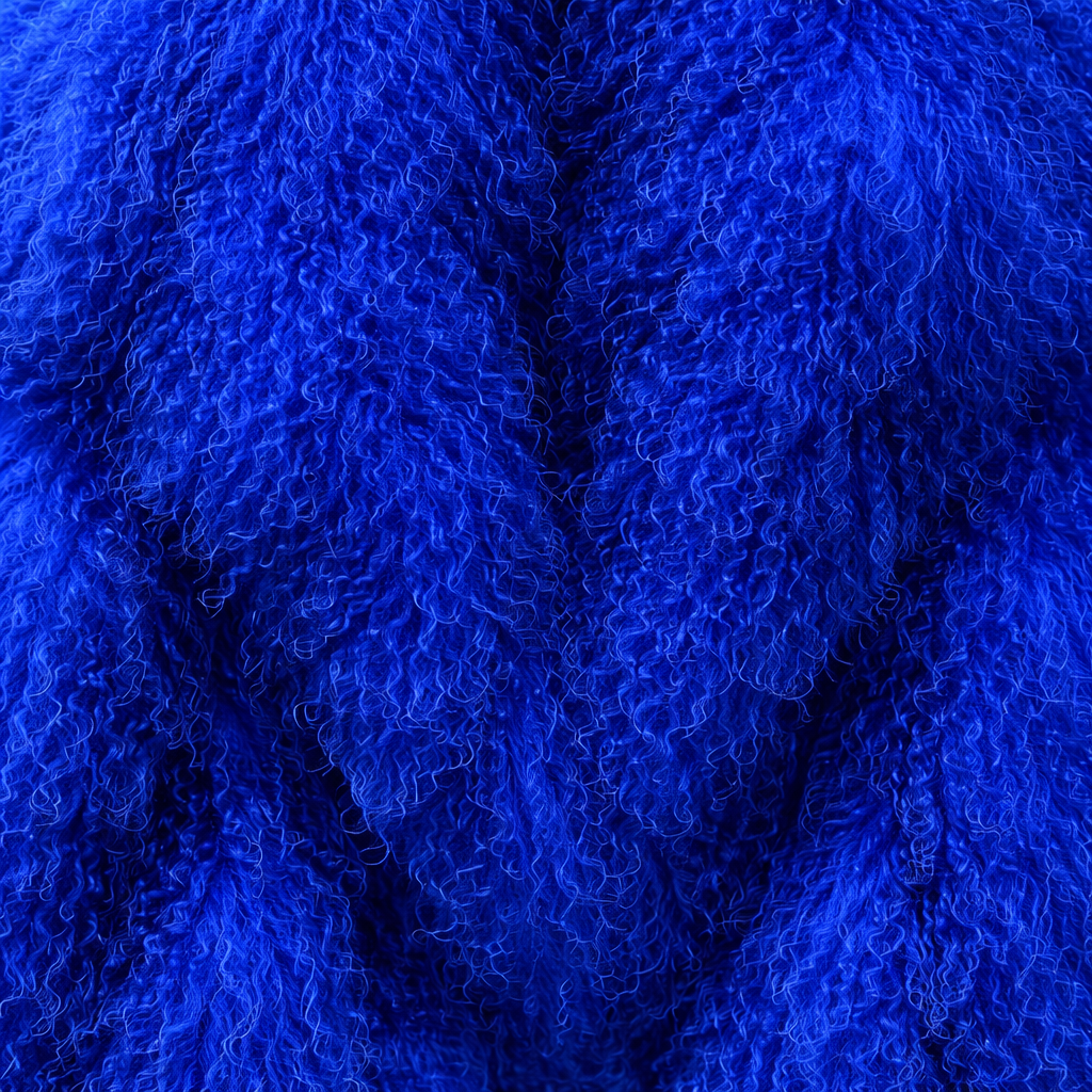 Close-up of blue Mongolian fur coat showing dense curly shearling texture – UK women’s winter outerwear