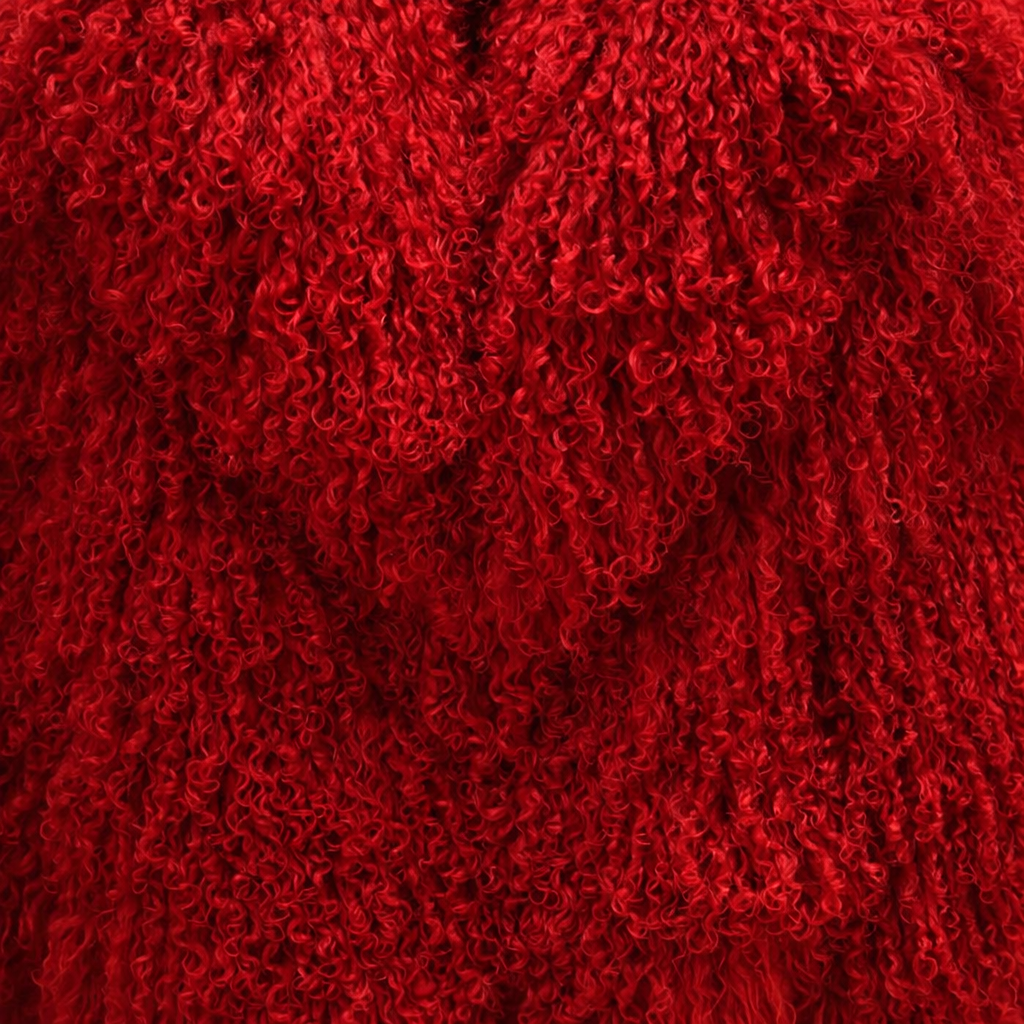 Close-up of Red Mongolian fur coat showing dense curly shearling texture – UK women’s winter outerwear