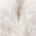 Close-up of white Mongolian fur coat showing dense curly shearling texture – UK women’s winter outerwear